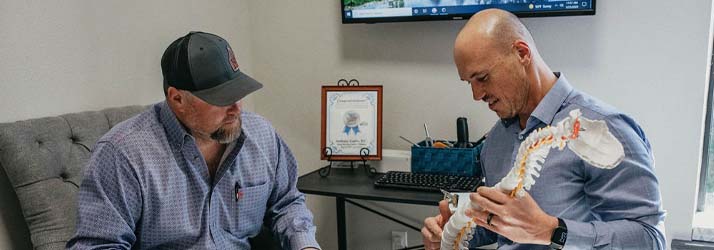Chiropractor Mont Belvieu TX Anthony Garbs Teaching Client